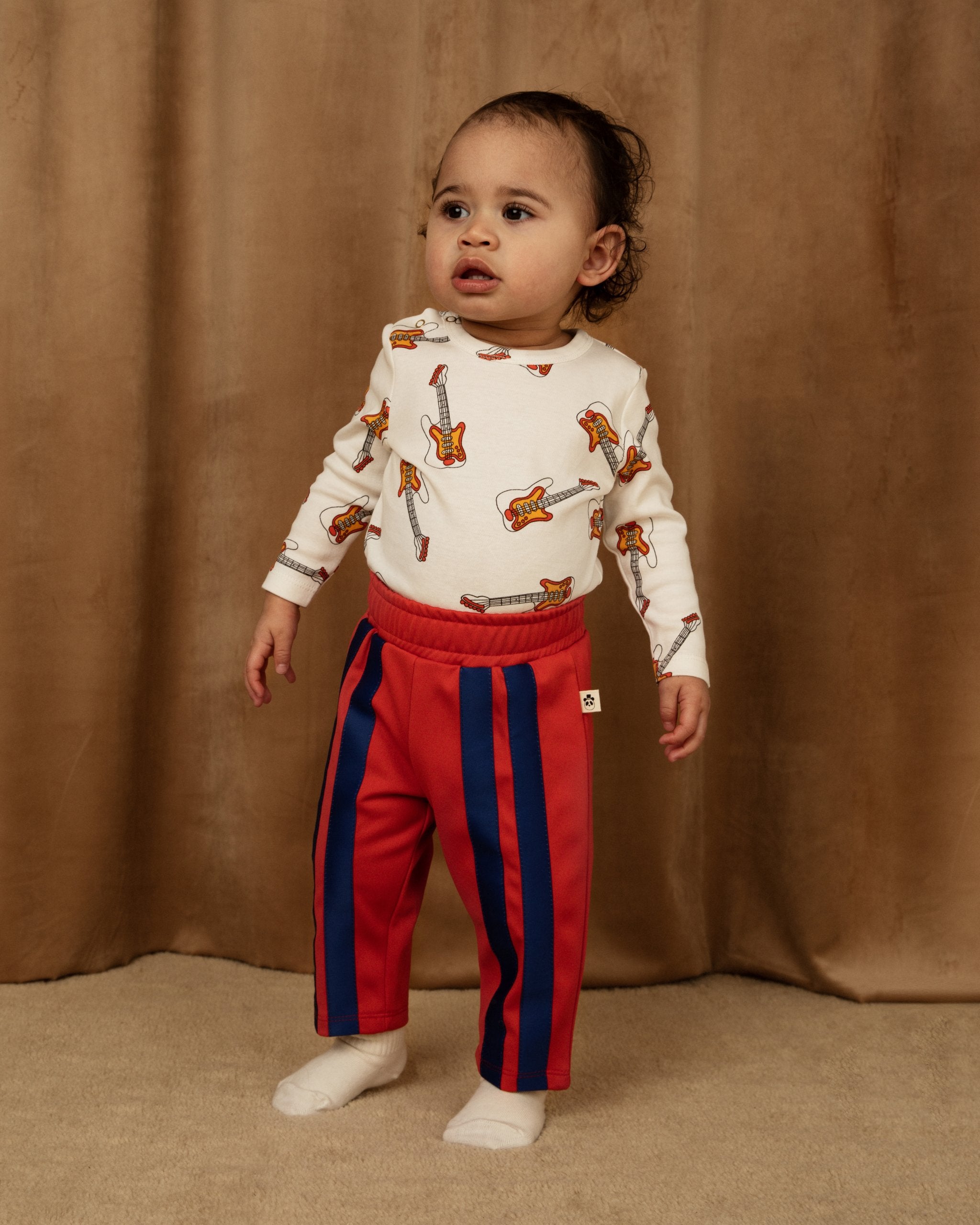 MINI RODINI - Track pants with elastic waist and stripe detailing in red with blue stripes