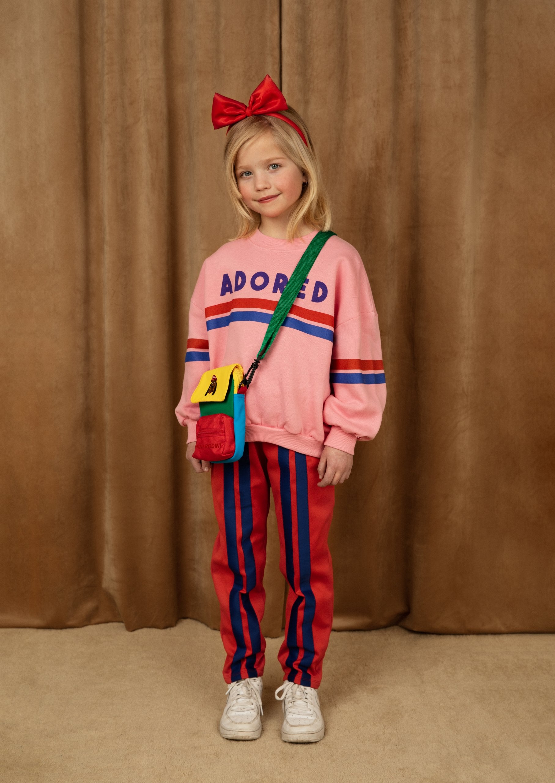 MINI RODINI - Track pants with elastic waist and stripe detailing in red with blue stripes