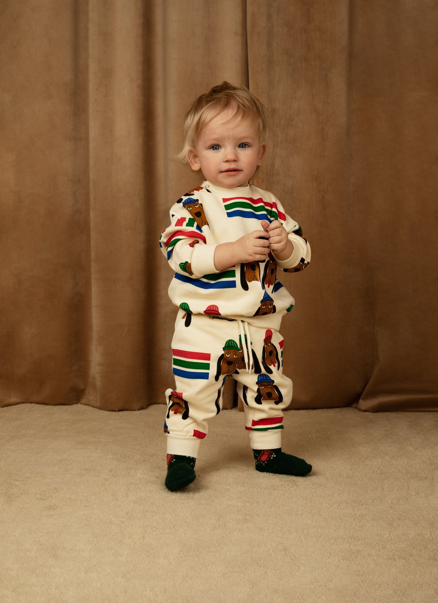 MINI RODINI - Bloodhound - young child wearing tracksuit with bloodhound dog illustrations with red blue and green stripes
